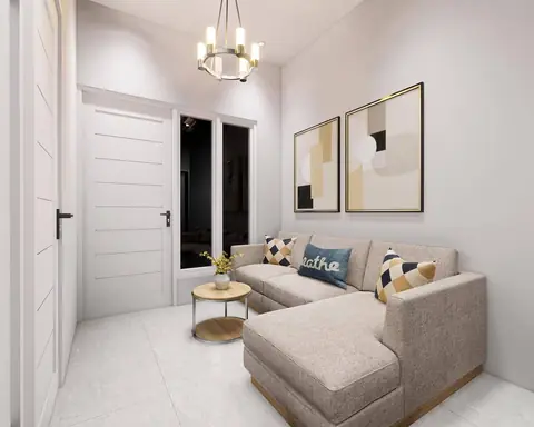 Ruang tamu kecil dengan sofa sudut krem, bantal bermotif, dan lampu gantung